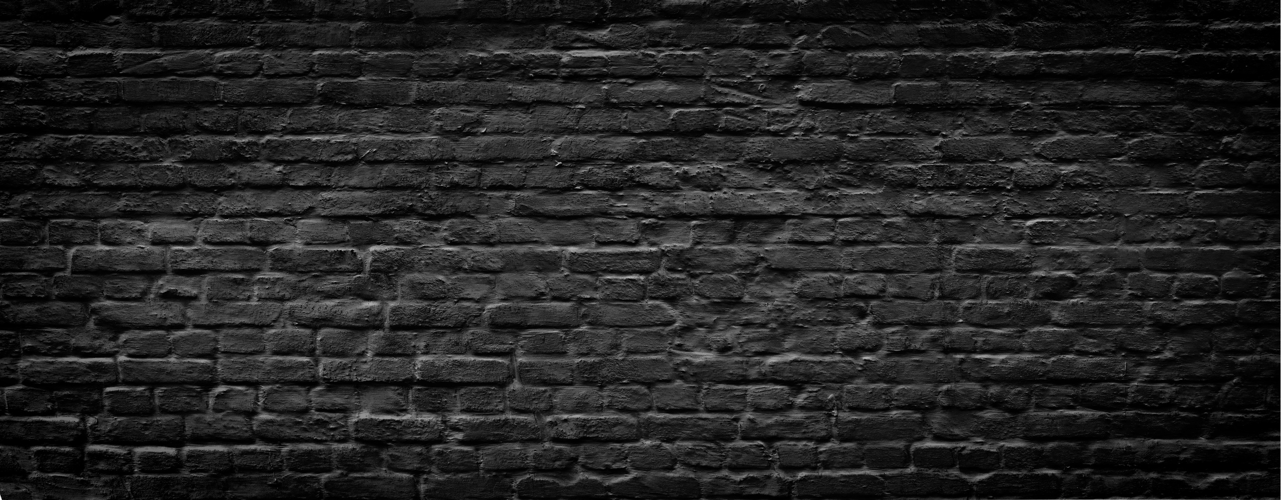 Black brick wall panoramic background